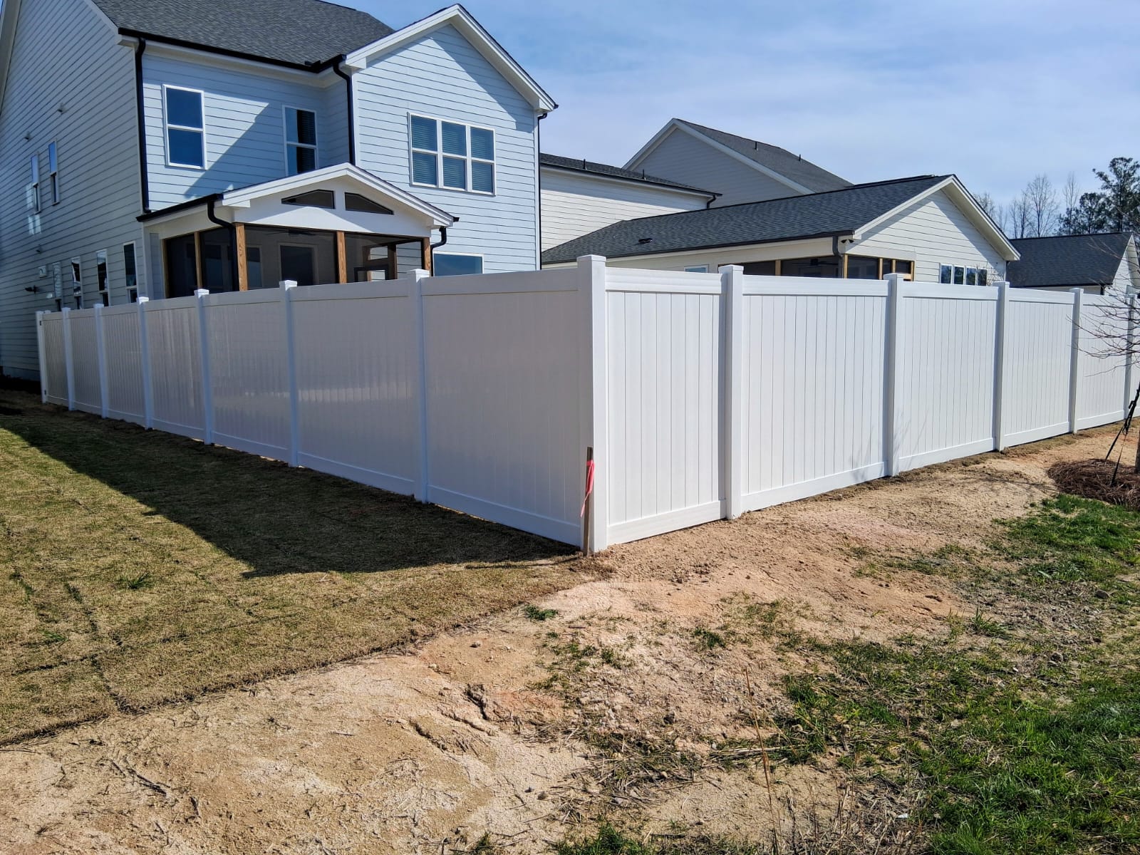 White vinyl privacy fence installation