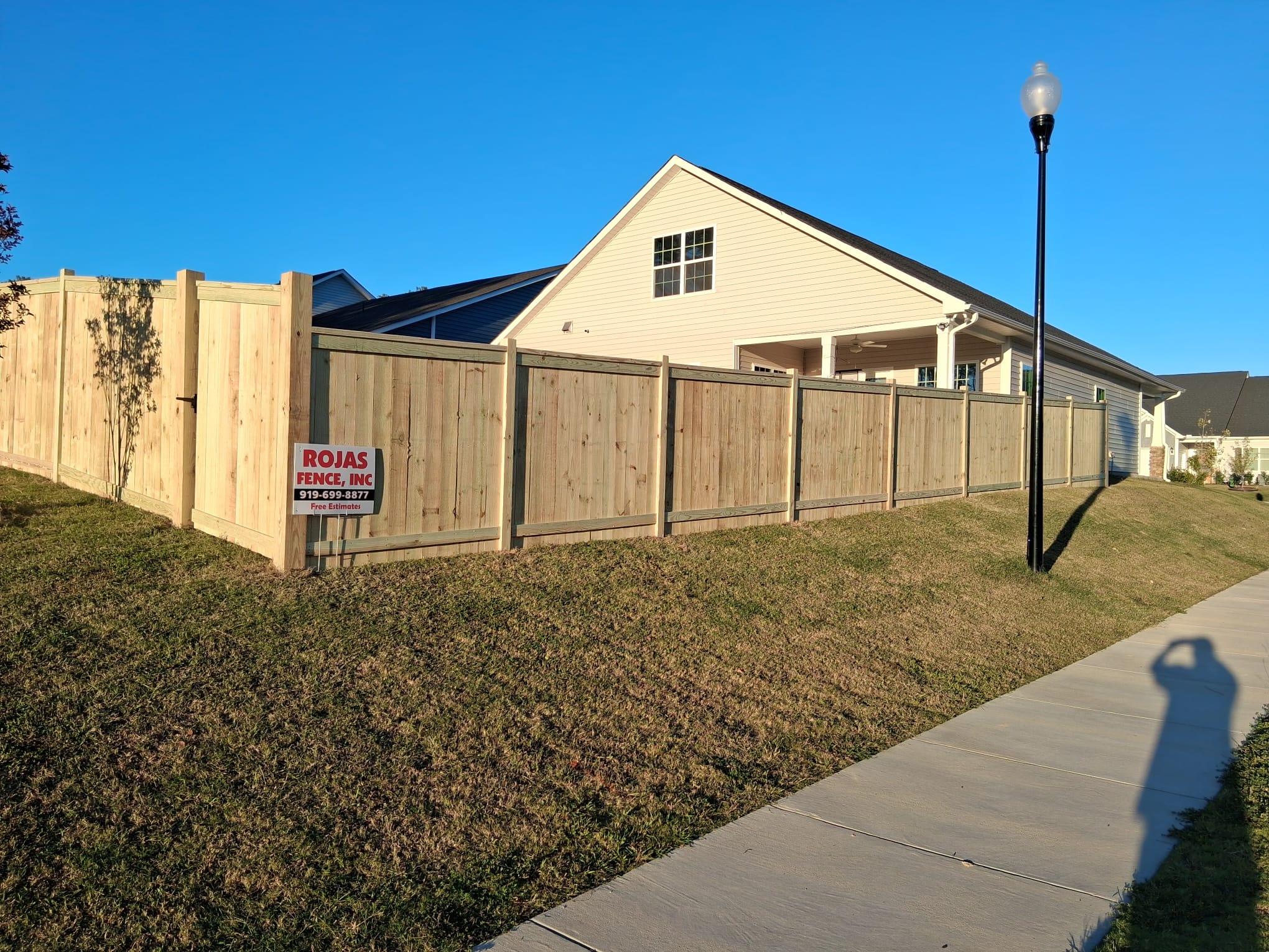 Wood privacy fence installed by Rojas Fence Inc.