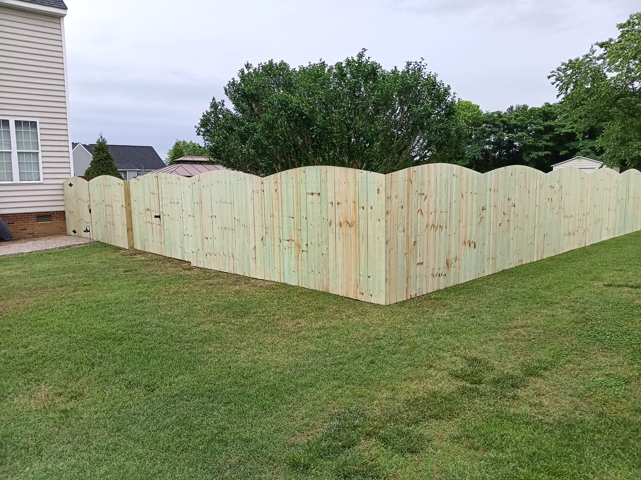 Wood privacy fence installation